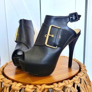 Black heels with gold buckle
